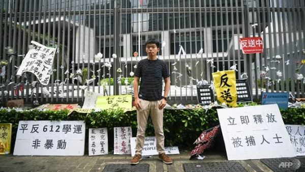Hong Kong democracy activist Joshua Wong poses during an interview with AFP outside the government headquarters. (AFP/Anthony Wallace)