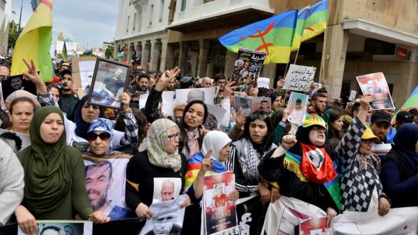 Moroccans shout slogans while waving the Berber, or Amazigh, flag during a demonstration against the court of appeal rulings on Al-Hirak al-Shaabi or "Popular Movement" activists, in the capital Rabat on April 21, 2019. (AFP/ File)