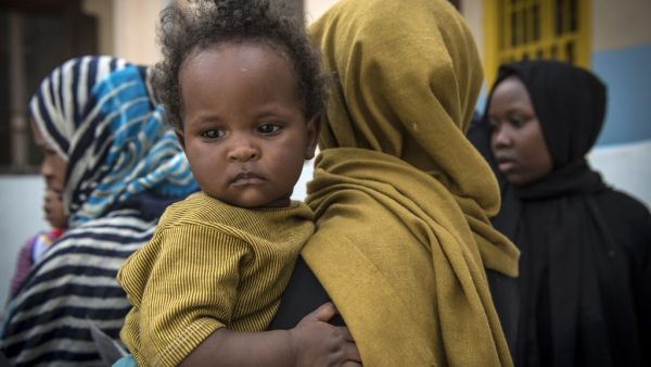 Sudanese refugees, who fled from the clashes between forces loyal to the internationally recognised Government of National Accord (GNA) and forces loyal to strongman Khalifa Haftar, rest at a school in Libya's capital Tripoli on April 24, 2019.  FADEL SENNA / AFP