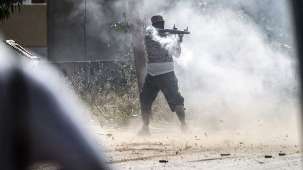 A fighter loyal to the internationally recognised Government of National Accord (GNA) fires a rocket-propelled grenade during clashes with forces loyal to strongman Khalifa Haftar south of the capital Tripoli's suburb of Ain Zara, on April 25, 2019.  FADEL SENNA / AFP