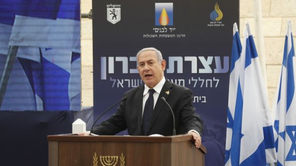 Israeli Prime Minister Benjamin Netanyahu delivers a speech during a ceremony marking Memorial Day, which commemorates the fallen soldiers of Israel, at a monument in Jerusalem, on May 7, 2019. (RONEN ZVULUN / POOL / AFP)