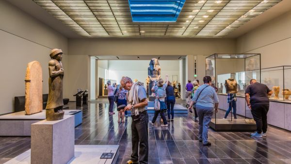 The Louvre. Visitors looking at exhibits in the 2nd Gallery of the Louvre, dedicated to The First Great Powers. (Shutterstock/ File Photo)