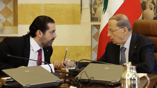 Lebanese President Michel Aoun, right, and Prime Minister-designate Saad Hariri at the presidential palace. (AFP)