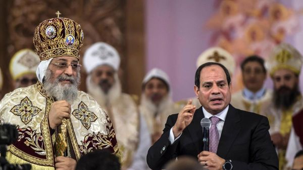 Egyptian president Abdel Fattah El Sisi speaks during a Christmas Eve mass as Coptic Pope Tawadros II looks on at the new Nativity of Christ Cathedral. (AFP/ File Photo)