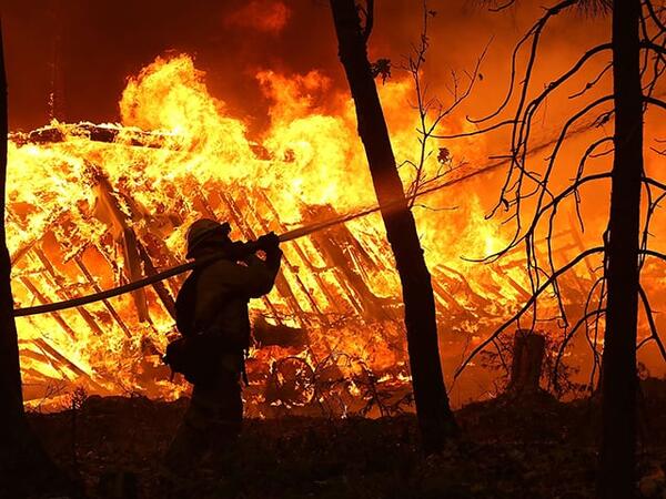 Nine people were declared dead and tens of thousands evacuated Friday as fierce wildfires raged across the western US state of California. (AFP/ File)