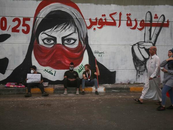 Iraqi protesters rest at Baghdad's Tahrir square during ongoing anti-government demonstrations on November 2, 2019. Iraqi security forces clashed with anti-government protesters in the early hours of Saturday near the capital's Tahrir Square, leaving one demonstrator dead and dozens more wounded, medical sources said. AHMAD AL-RUBAYE / AFP