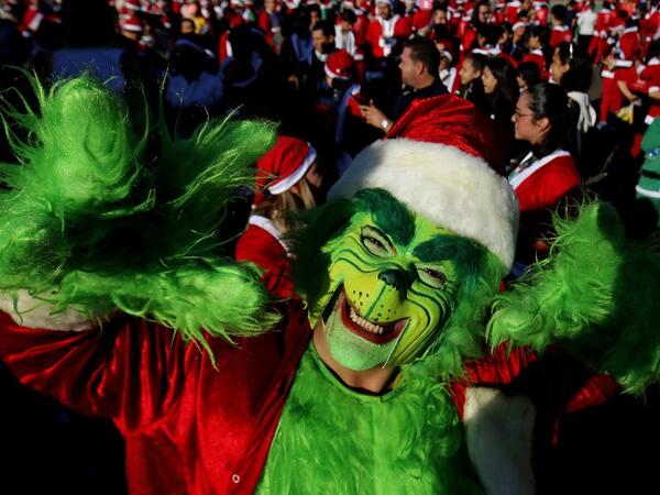 A participant dressed as the Green Goblin in Santa Claus costume participate in the "Run Santa Run Guadalajara" annual Christmas race, in Guadalajara, Mexico, on December 8, 2019. Ulises RUIZ / AFP