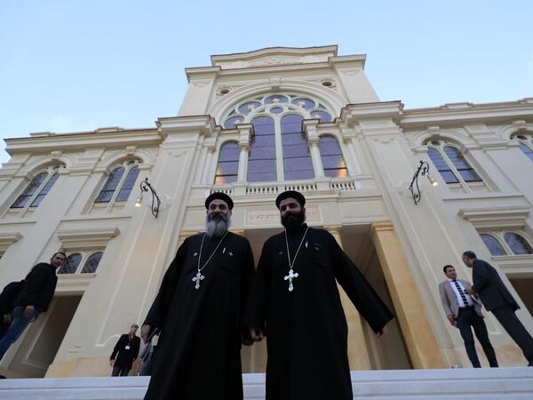 Coptic priests leave after visiting the newly renovated Eliyahu Hanavi synagogue in the northwestern Egyptian city of Alexandria on January 10, 2020, on the day of its inauguration. The synagogue, boasting green and violet stained glass windows and towering marble columns, was built in its current form in 1850 by an Italian architect on top of the original edifice dating back to 1354. Khaled DESOUKI / AFP