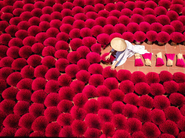 Vietnamese workers collect dried incense sticks in Quang Phu Cau village on the outskirts of Hanoi on January 9, 2020 ahead of the upcoming Lunar New Year celebrations, referred to in Vietnam as Tet. (Shutterstock)