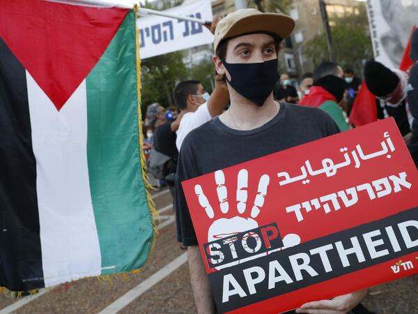 Protesters gather in Tel Aviv's Rabin Square on June 6, 2020, to denounce Israel's plan to annex parts of the occupied West Bank. Israeli Prime Minister Benjamin Netanyahu has vowed to forge ahead with annexing settlements and the Jordan Valley, in line with the peace proposals unveiled in January by US President Donald Trump. The plan has been angrily rejected by the Palestinians, who say they were not consulted on proposals they see as capitulating to Israeli demands. JACK GUEZ / AFP