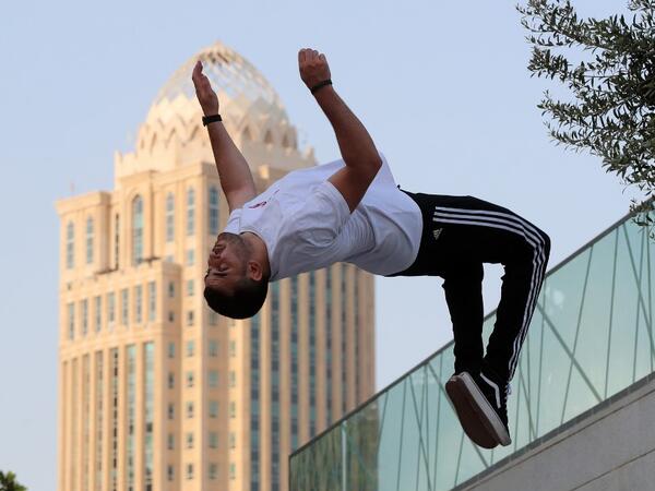 Achref Bejaoui, 25, performs parkour, a sport that originated in France in the 1990s, which involves getting around urban obstacles with a fast-paced mix of jumping, vaulting, running and rolling, in the Qatari capital Doha, on August 11, 2020. Parkour, also known as free-running, has now found a small but committed following in Qatar despite evening temperatures that hover around 40 degrees Celsius (104 Fahrenheit) in summer and over-zealous security guards unfamiliar with the sport. KARIM JAAFAR / AFP