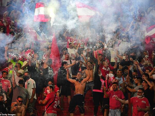 Grieving fans let off flares at the Argentinos Juniors stadium where Maradona began his professional career in the 1970s. (AFP/File)