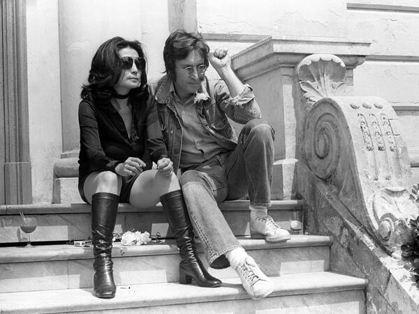 In this file photo taken on May 17, 1971 Music legend John Lennon and his wife Yoko Ono pose for photographers in Cannes 17 May 1971 where they presented their movies 'Apotheosis' and 'The Flu'. John Lennon's career was cut short 40 years ago, on December 8, 1980, when he was shot dead in New York.   AFP
