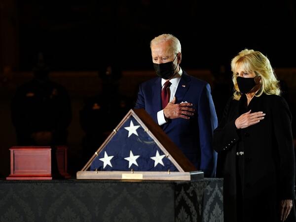 US President Joe Biden and First Lady Jill Biden pay their respects to late US Capitol Police officer Brian Sicknick, as he lies in honor in the Capitol Rotunda in Washington, DC February 2, 2021. Sicknick died on January 7 from injuries he sustained while protecting the US Capitol during the January 6 attack on the building erin schaff / POOL / AFP
