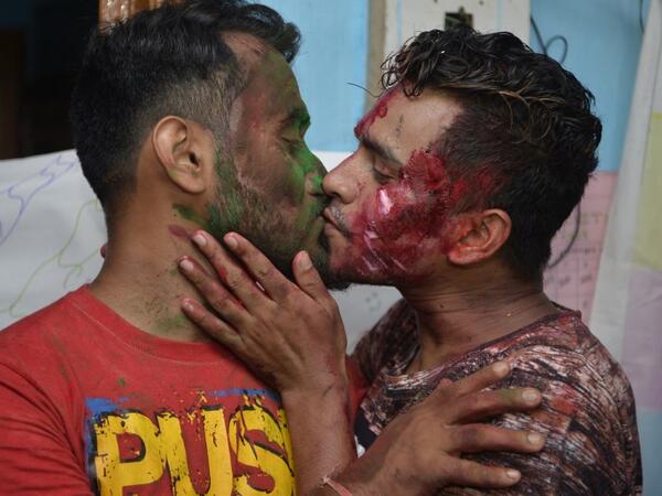 Indian members and supporters of the lesbian, gay, bisexual, transgender (LGBT) community celebrate the Supreme Court decision to strike down a colonial-era ban on gay sex, in Siliguri on September 6, 2018 /AFP