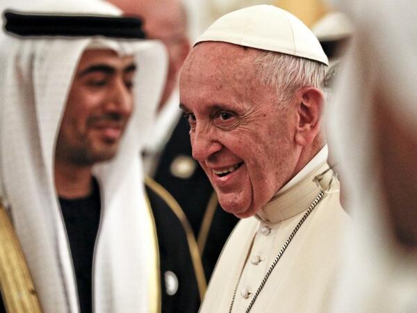 Pope Francis smiles upon his arrival at Abu Dhabi International Airport in the UAE capital on February 3, 2019. 
Andrew Medichini / POOL / AFP