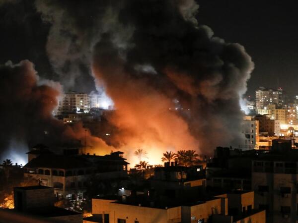 Fire and smoke billow above buildings in Gaza City during reported Israeli strikes on March 25, 2019. Israel's military launched strikes on Hamas targets in the Gaza Strip today, the army and witnesses said, hours after a rocket from the Palestinian enclave hit a house and wounded seven Israelis.
Mahmud Hams / AFP