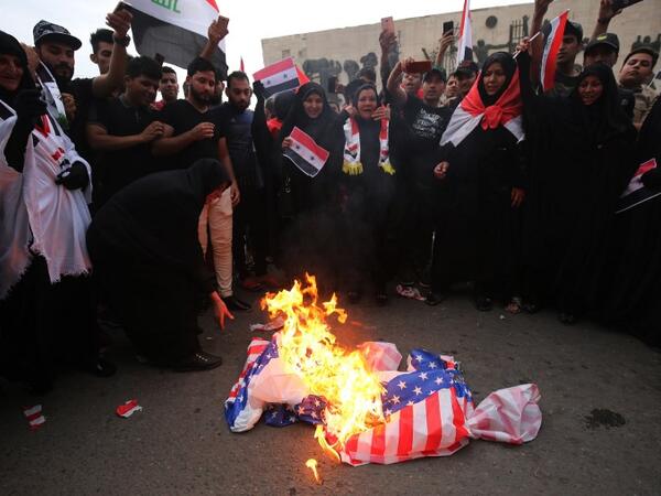 Iraqi protestors burn a US flag during a demonstration in Baghdad on April 15, 2018, opposing the joint Western air strikes against Syria's regime. The United States, Britain and France took military action in response to an alleged chemical attack in the rebel-held town of Douma a week ago that killed at least 40 people. Iraq warned that Western air strikes on Syria is a "very dangerous" development that could fuel a jihadist resurgence in the region
Ahmad al-Rubaye / AFP