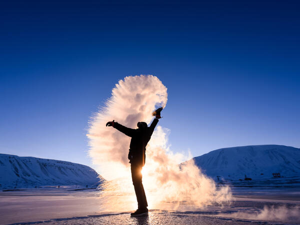 Frost effect hot water freezes man pours boiling water. (Shutterstock/ File Photo)