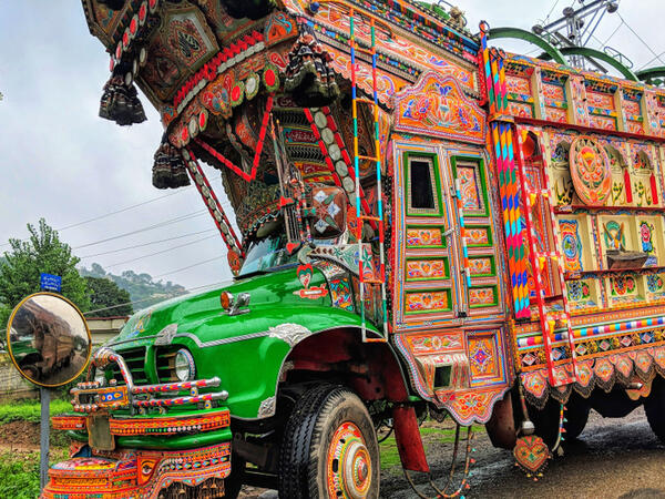 Beautifully decorated huge traditional Pakistani truck on the way to Kotli Town centre, coloured and black and white (Shutterstock)	