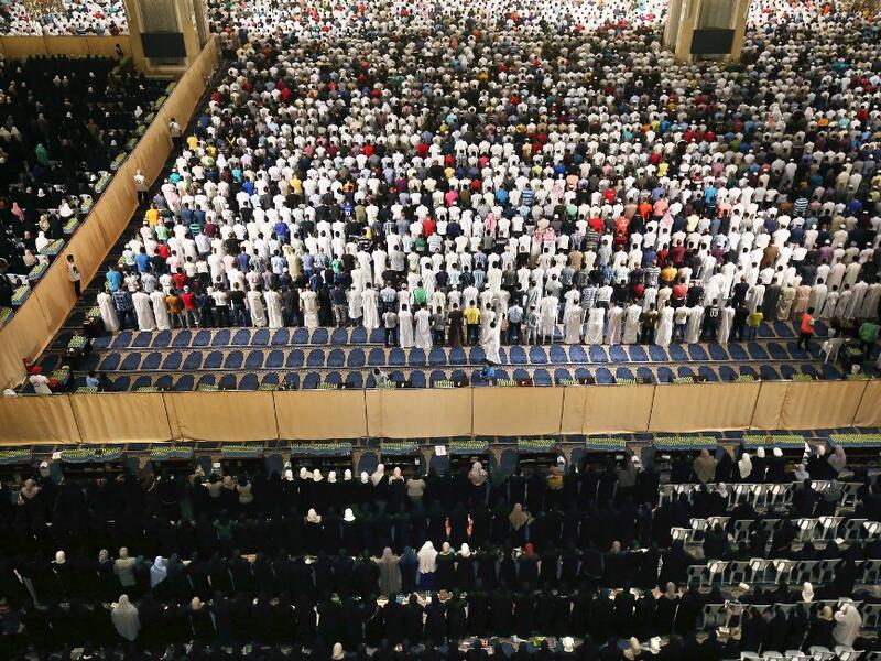 Muslim worshippers pray early on June 1, 2019 at Kuwait City's Grand Mosque on the occasion of Lailat al-Qadr, which marks the night in the fasting month of Ramadan during which the Koran was first revealed to Prophet Mohammed in the seventh century.  Yasser Al-Zayyat / AFP
