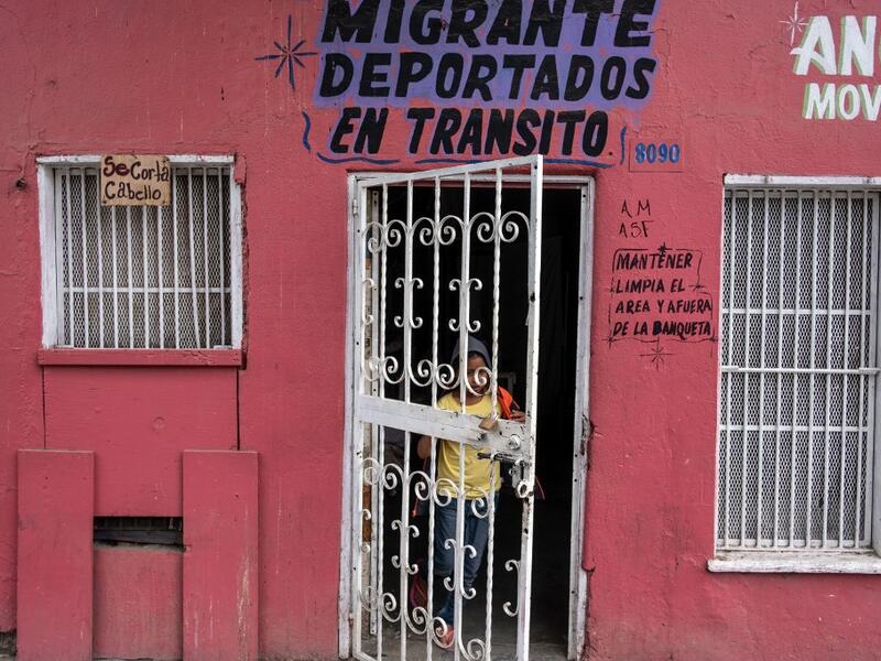 A migrant girl walks out of the Juventud 2000 II shelter in Tijuana, Baja California state, on June 19, 2019, Mexico ahead of World Refugees Day. World Refugee Day is observed June 20 each year internationally to raise awareness of the situation of refugees throughout the world.  (Guillermo Arias / AFP)