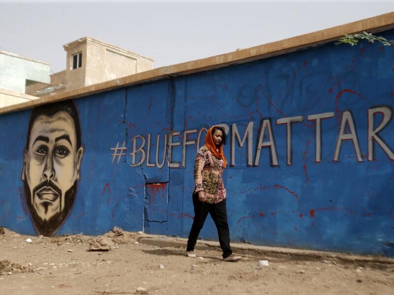 Mattar was among dozens killed in the June 3 raid on a protest camp outside the military headquarters. The colourful graffiti is part of a campaign to draw faces of protesters killed on June 3 and during the months-long protest movement against now ousted leader Omar al-Bashir on the walls of their family homes.  ASHRAF SHAZLY / AFP