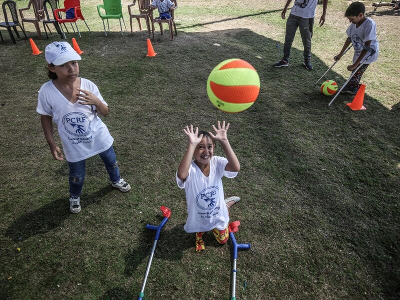 Palestinian amputee children play during a summer camp origanized by the Palestinian Children's Relief Fund (PCRF) in the town of Khan Yunis in the southern Gaza strip on August 3, 2019. SAID KHATIB / AFP