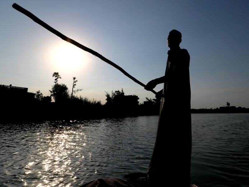 An Egyptian Fisherman sails in the waters of the Pharaonic Sea in the village of Kafr Fisha, province of Monufia, on August 13, 2019.Mohamed el-Shahed / AFP