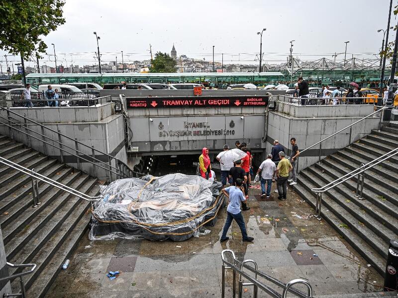 Turkey's mega city Istanbul was lashed by a heavy rainstorm on August 17, killing a homeless man and leaving parts of the historic Grand Bazaar flooded.  Ozan KOSE / AFP