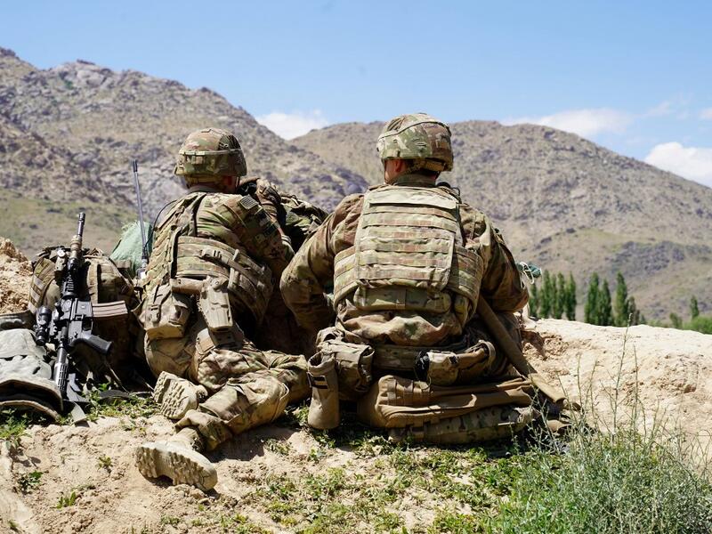 US soldiers look out over hillsides during a visit of the commander of US and NATO forces in Afghanistan at the Afghan National Army (ANA) checkpoint in Nerkh district of Wardak province. (AFP/ File Photo)
