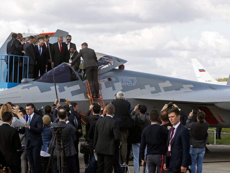 Russian President Vladimir Putin and his Turkish counterpart Recep Tayyip Erdogan inspect Sukhoi Su-57 fifth-generation fighter during the MAKS-2019 International Aviation and Space Salon opening ceremony in Zhukovsky outside Moscow on August 27, 2019.  Maxim SHIPENKOV / POOL / AFP