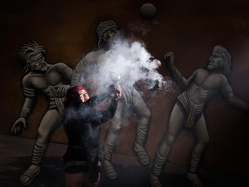 Mexican Beatriz Campos, player of a pre-Columbian ballgame called "Ulama" -in Nahuatl indigenous language- performs the "Copal" ceremony ahead of a match at the FARO Poniente cultural center in Mexico City on August 21, 2019. Omar Torres / AFP