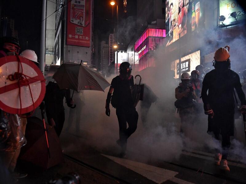 Protesters walk through a cloud of teargas as they occupy Hennessy Road in Hong Kong on August 31, 2019. (AFP/ File Photo)