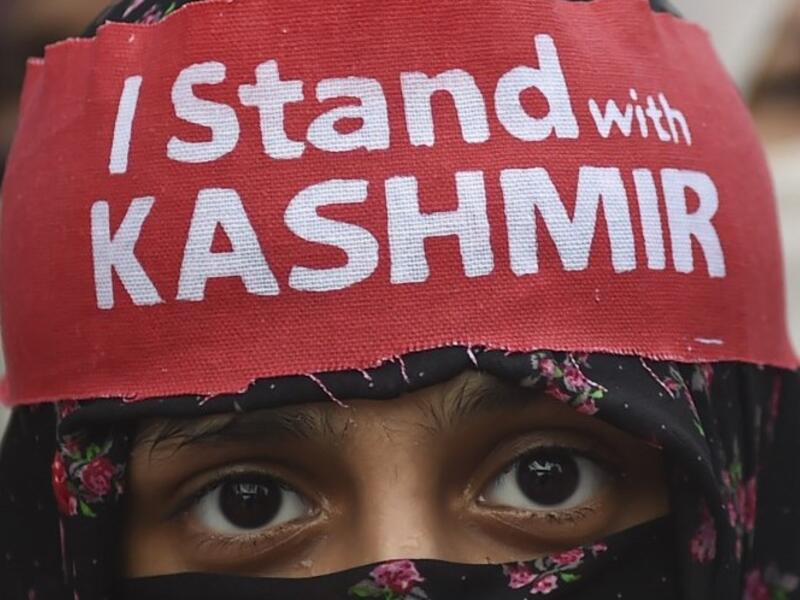 An activist of Jamaat-e-Islami Pakistan takes part of a protest rally against the Indian decision to strip the disputed Kashmir region of its special autonomy, in Karachi  (AFP)