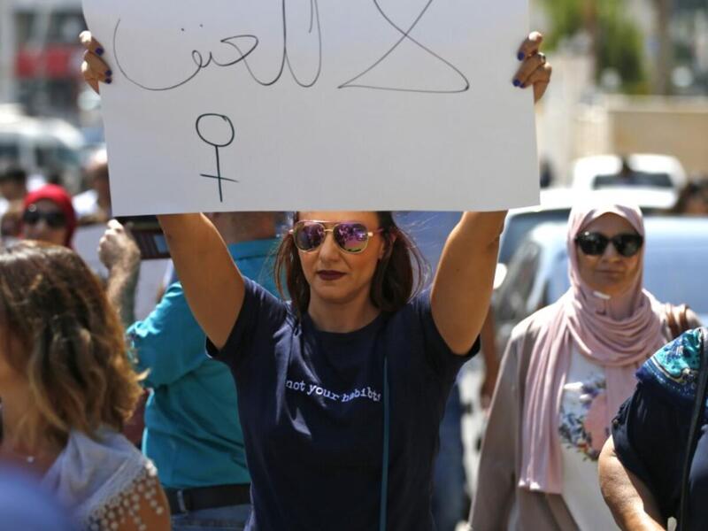 Palestinian women protest in support of women’s rights outside the prime minister’s office in the West Bank city of Ramallah (AFP)
