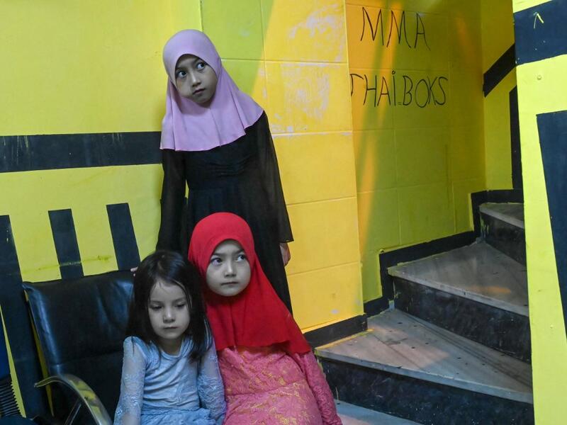 In this photograph taken on August 29, 2019, girls from the Uighur minority attend a boxing training session in a boxing academy in Istanbul. BULENT KILIC / AFP