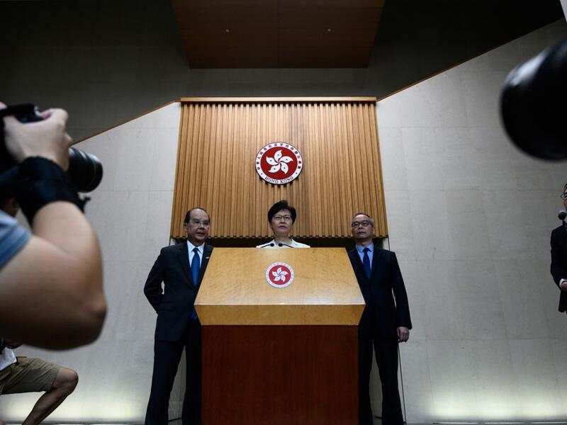 Hong Kong Chief Executive Carrie Lam (C) speaks at a press conference in Hong Kong on September 5, 2019, a day after she announced the withdrawal of a loathed extradition bill. (AFP/ File Photo)
