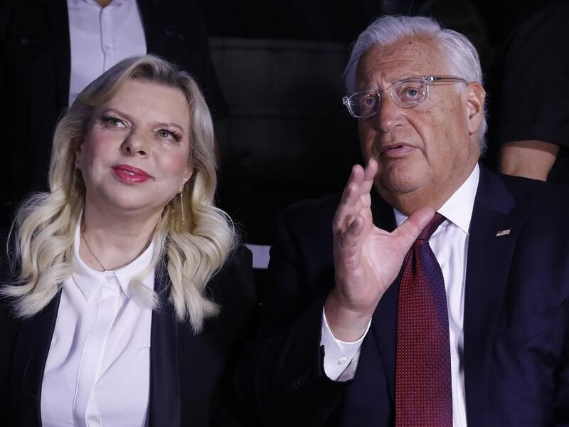 US ambassador to Israel David Friedman (R) speaks with Sara Netanyahu, wife of the Israeli Prime Minister, as they attend a ceremony commemorating the eve of the 18th anniversary of the September 11, 2001 terror attacks in New York City, at the 9/11 Living Memorial Plaza on a hill overlooking Jerusalem AHMAD GHARABLI / AFP