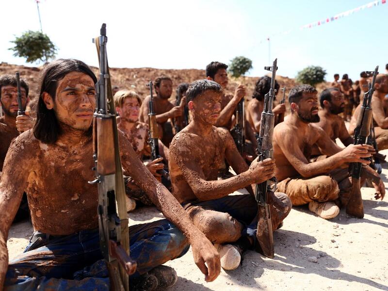 Turkish-backed fighters from al-Mutasim Brigade take part in a training at a camp near the Syrian town of Marea in the northern Aleppo district, on September 12, 2019. Nazeer Al-khatib / AFP