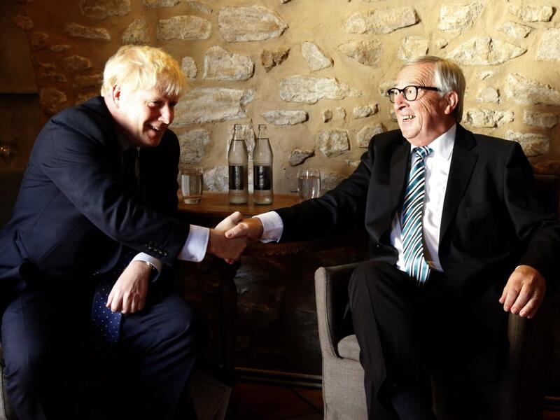 EU Commission president Jean-Claude Juncker (R) shakes hands with British Prime Minister Boris Johnson (L) prior to their meeting, on September 16, 2019 in Luxembourg. (AFP/ File Photo) EU Commission president Jean-Claude Juncker (R) shakes hands with British Prime Minister Boris Johnson (L) prior to their meeting, on September 16, 2019 in Luxembourg. (AFP/ File Photo)