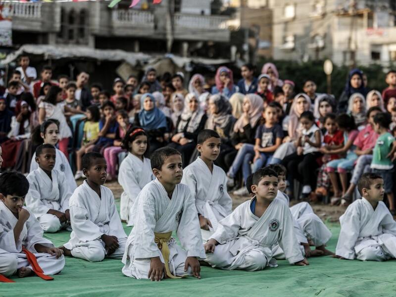 Young Palestinian karatekas attend a Karate promotion ceremony at a sporting centre in the Rafah camp for Palestinian refugees in the southern Gaza Strip on September 20, 2019. SAID KHATIB / AFP
