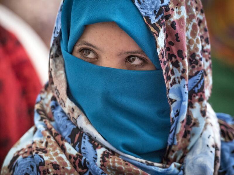 A Young Amazigh (Berber) woman waits for her wedding ceremony during the annual "Engagement Moussem" festival near the village of Imilchil in central Morocco's high Atlas Mountains on September 21, 2019. Each year in the High Atlas Mountains hamlet of Ait Amer, tribes celebrate with dances and music, the collective wedding of young Amazigh couples during the traditional festival of "Engagement Moussem". FADEL SENNA / AFP