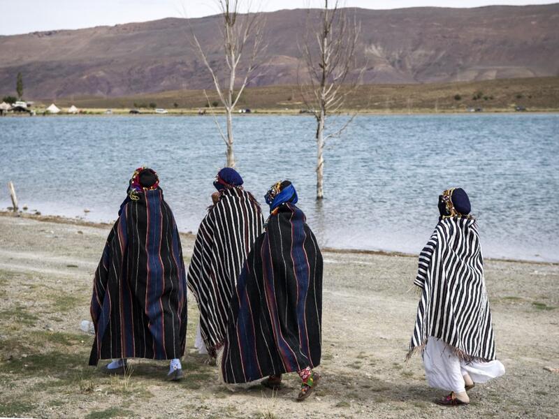 Amazigh (Berber) women arrive to take part in the annual "Engagement Moussem" festival near the village of Imilchil in central Morocco's high Atlas Mountains on September 21, 2019. Each year in the High Atlas Mountains hamlet of Ait Amer, tribes celebrate with dances and music, the collective wedding of young Amazigh couples during the traditional festival of "Engagement Moussem". FADEL SENNA / AFP