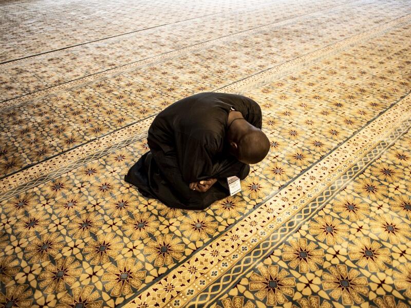 A worshipper reacts after entering the Great Mosque of the Mourides on September 27, 2019 in Dakar, ahead of its inauguration. Senegal's influential Mouride Brotherhood will inaugurate a 30,000-capacity mosque in the capital Dakar, said to be the largest in West Africa. JOHN WESSELS / AFP