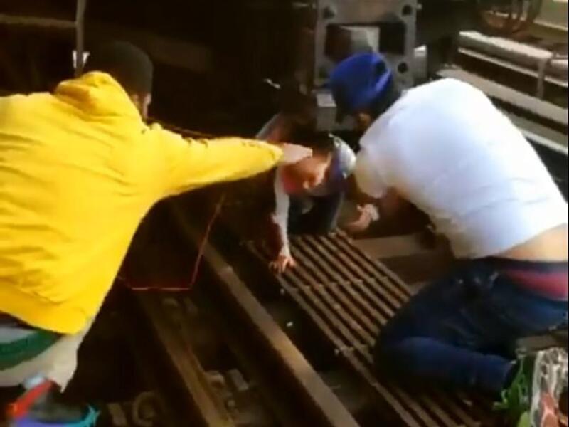 Cesar Dominguez (right), 29, was one of those good Samaritans said he 'had to jump down' after he heard the young girl crying 'my dad, my dad'. (Instagram)
