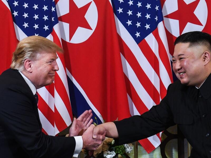 US President Donald Trump shakes hands with North Korean leader Kim Jong-un following a meeting in Hanoi, Vietnam, in February. (AFP)