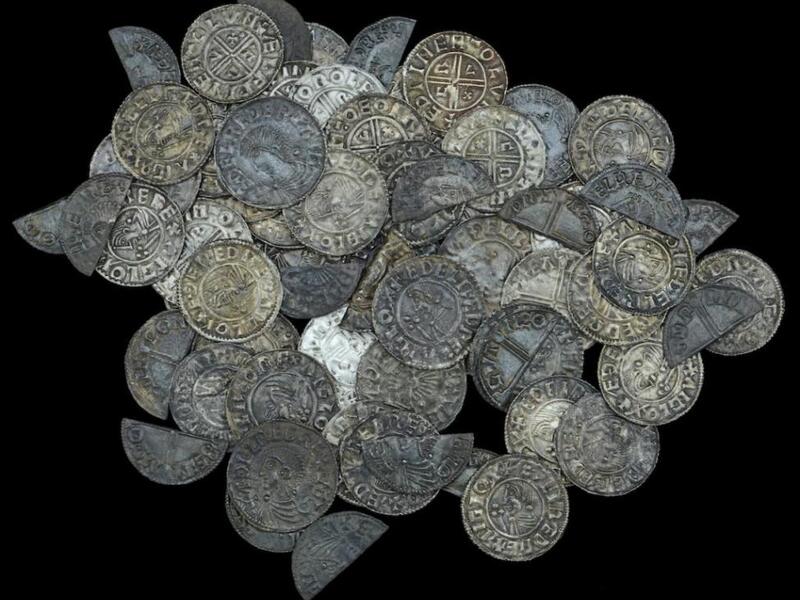 A British man with a metal detector found nearly 100 silver pennies dating back 1,000 years on a farmer's property. (Photo courtesy of Dix Noonan Webb Auctions)