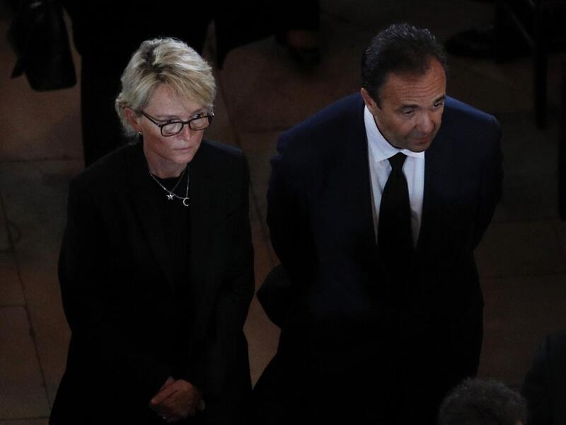 Claude Chirac, daughter of late French president Jacques Chirac, and her husband Frederic Salat-Baroux leave Saint Sulpice church in the Paris following her father's final service on September 30, 2019.  Francois Mori / POOL / AFP