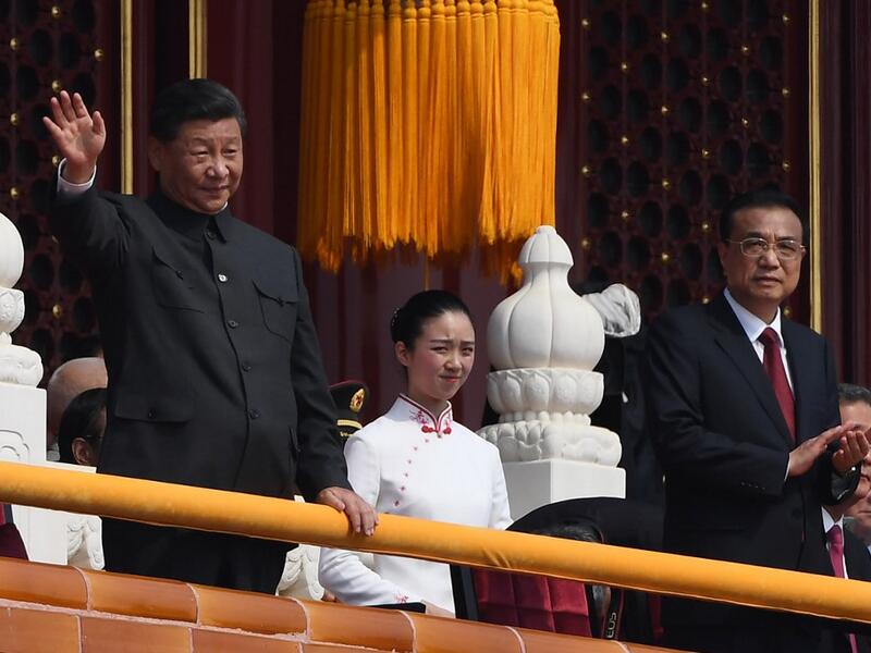 Chinese President Xi Jinping (C) attends a military parade with former presidents Hu Jintao (L) and Jiang Zemin in Tiananmen Square in Beijing on October 1, 2019, to mark the 70th anniversary of the founding of the PeopleÕs Republic of China. GREG BAKER / AFP